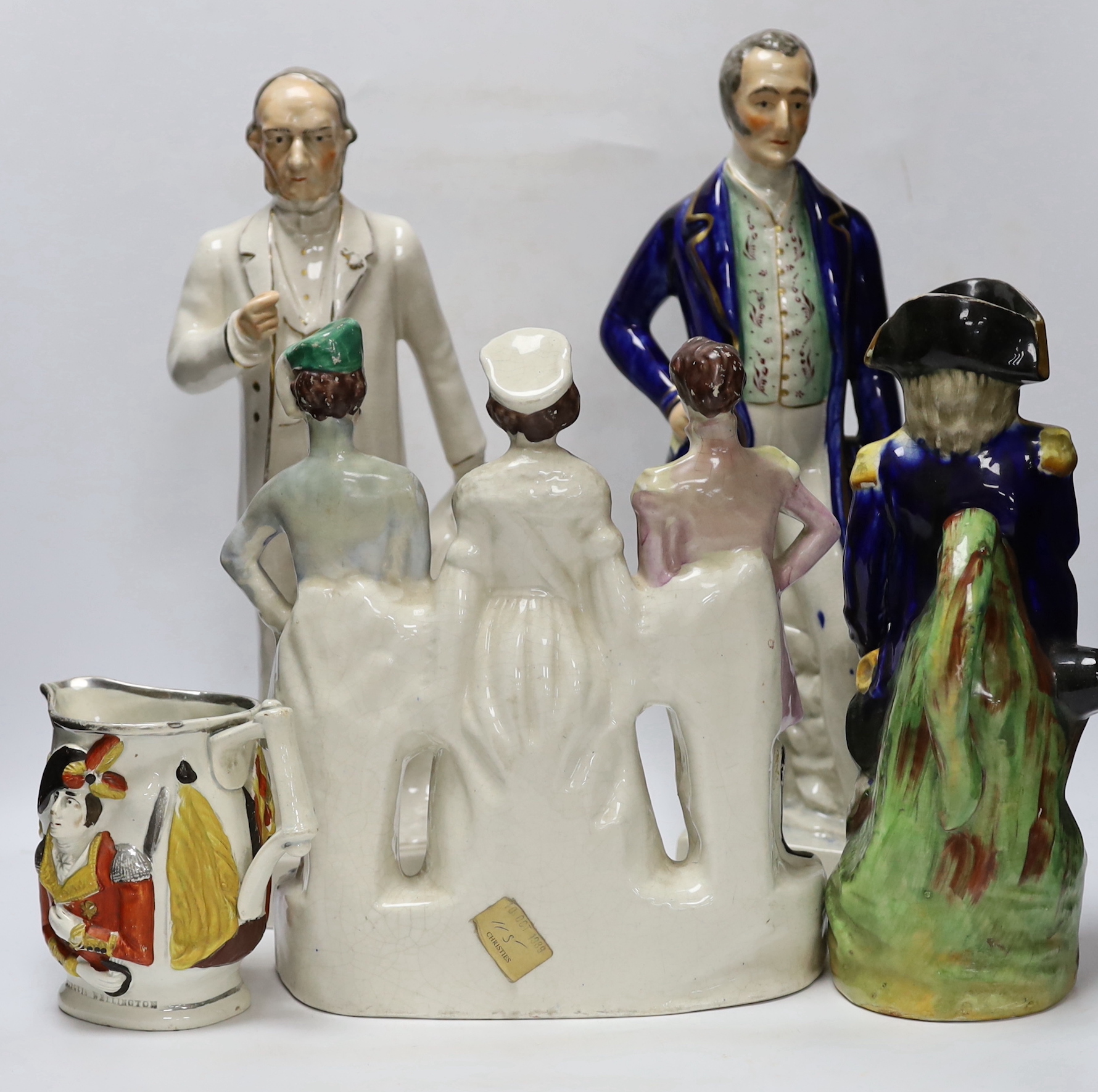Military and Political Staffordshire figures - A Crimean war group of France, England and Turkey, a figure of Wellington as Prime Minister, a figure of Gladstone, a Nelson Toby jug and a General Hill/Marquis Wellington c